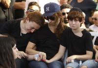 The family of Major Amotz Greenberg (res.), 45, mourns during his funeral at the military cemetery in Hod HaSharon on Sunday. (Photo: Miriam Alster/Flash90)