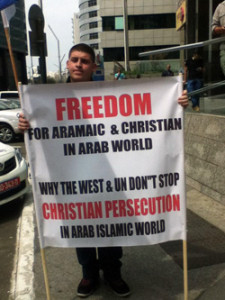 christian-arab-sign-carrier-225x300.jpg