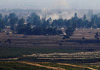 Smoke rises near Quneitra Crossing as it seen from the Golan Heights in the Israeli side .