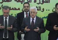 Palestinian president Mahmoud Abbas (C) prays before delivering a statement in the Ramallah last week calling for "all means" to keep Jews away from the Temple Mount. (Photo: FLASH90)