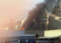 A fire rages in the compound of Mosul's 1800-year-old church. (Photo: Gatestone)