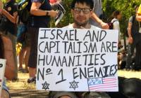 A demonstrator invokes Nazi imagery in his anti-Israel "protest." (Shutterstock)