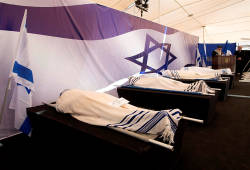 The bodies of the four French-Jewish victims of terror ready for burial in Jerusalem. (Photo: Amit Shabi/Flash90)