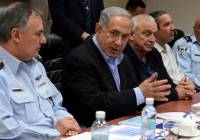 Israeli Prime Minister Benjamin Netanyahu (C), Chief of Police Yohanan Danino (L), and Minister of Internal Security Yitzhak Aharonovitch seen during a meeting on the storm which is expected to hit Israel later this afternoon, at the Ministry of Public Security in Lod, on February 19, 2015. photo by Haim Zach / GPO