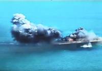 A replica of a US ship explodes during Iranian naval maneuvers.