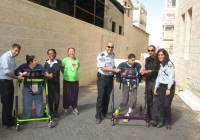 ALEH children with Israel Police officers prepare for the Jerusalem Marathon. (Courtesy)