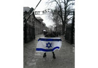 Girl Stands Outside Auschwitz Holding Israel Flag