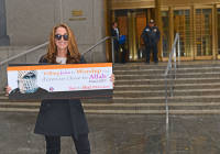 Pamela Geller holds the anti-Hamas ad.