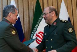 Iranian Defense Minister Sergei Shoigu (L) and Defense Minister Hossein Dehghan.