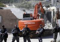 Israeli security forces stand guard during a home demolition. (Illustrative photo. Sliman Khader/Flash90)