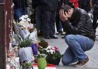 Man grieves in Paris on Saturday following Islamic terror attacks  the previous night. (AP)