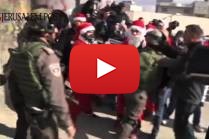 Palestinian Protesters Dress Like Santa Claus and Antagonize the IDF