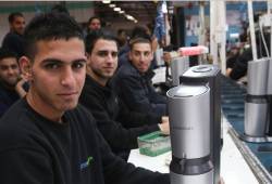 Palestinian employees at a SodaStream factory in Judea and Samaria last year before losing their jobs as a result of BDS. (Nati Shohat/Flash90)