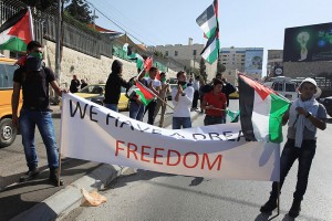 Palestinian protesters in Bethlehem demonstrate against US Secretary of State John Kerry's visit this week. Israeli Prime Minister Benjamin Netanyahu said on Wednesday that peace talks with the Palestinians had failed to make real progress and he hoped that Kerry could get them back on track. (Issam Rimawi/FLASH90)