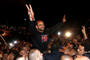 Terrorist Samer al-Issawi flashes the "V" for victory sign as he celebrates his release from an Israeli jail this month. (Photo: Sliman Khader/Flash90)