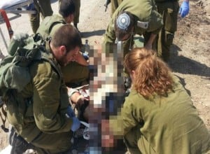IDF medics treat injured Syrians at makeshift hospital in northern Israel. (Photo: IDF blog)