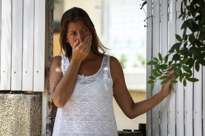 A woman reacts after her neighbor's house was hit by a Hamas rocket during the ceasefire. (Photo: Flash90)
