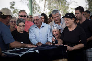 Grandparents of four-year-old Daniel Trigerman mourn during his funeral in southern Israel on Sunday. (Photo: Hadas Parush/Flash90)