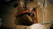 A terrorist emerges from a tunnel. (Khaled Omar/propaimages)