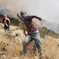 Palestinians attack with rocks.