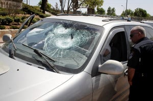 An Israeli car hit by Arab terrorists. (Photo by Gershon Elinson/Flash90)