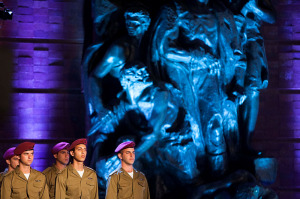 Israeli soldiers stand below a Yad Vashem monument on the Holocaust Remembrance Day. (Photo: Yonatan Sindel/Flash90)