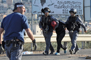 Police arrest an Arab rioter. (photo: Flash90)