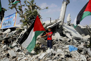 A boy in Gaza stands amid the ruins. (Photo: Abed Rahim Khatib/Flash90)