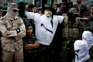 Hamas parades with an effigy of a Jew before burning it. (Photo: Rahim Khatib/ Flash90)