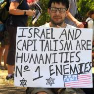 A demonstrator invokes Nazi imagery in his anti-Israel "protest." (Shutterstock)