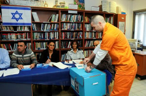 A prisoner casts his ballot for the 2013 parliamentary election at Rimonim prison. (Photo: Yossi Zeliger/Flash90)