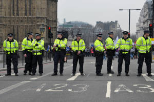British police stand guard near the Westminster bridge. (Photo: 1000 Words / Shutterstock)