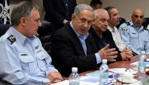 Israeli Prime Minister Benjamin Netanyahu (C), Chief of Police Yohanan Danino (L), and Minister of Internal Security Yitzhak Aharonovitch seen during a meeting on the storm which is expected to hit Israel later this afternoon, at the Ministry of Public Security in Lod, on February 19, 2015. photo by Haim Zach / GPO