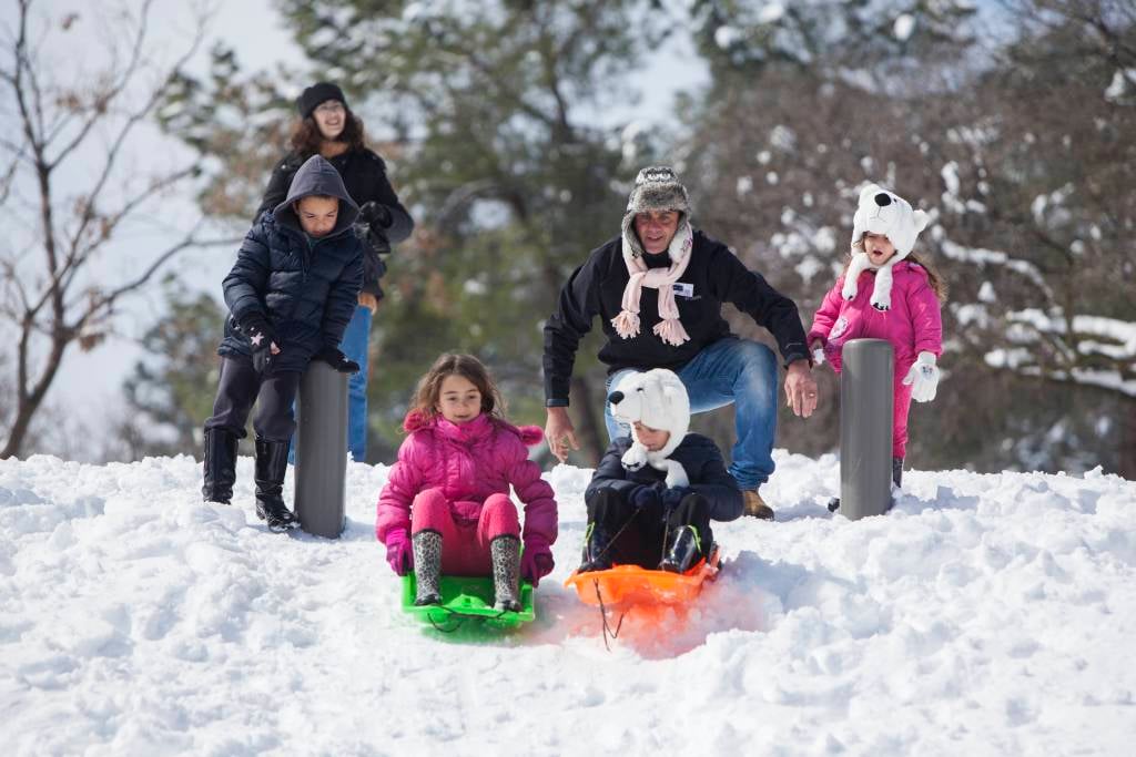 Kids sliding in Jerusalem's Independence Park. (Yonatan Sindel/Flash90)