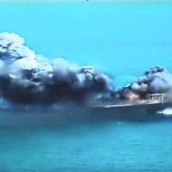 A replica of a US ship explodes during Iranian naval maneuvers.