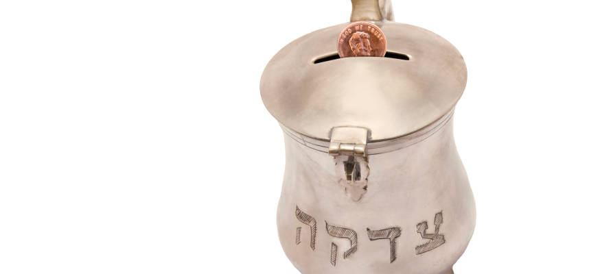 Traditional Jewish tzedaka container for giving charity. (Rhonda Roth/Shutterstock)