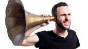 Man tries to hear with old-fashioned hearing aid. (Photo: Axel Alvarez/Shutterstock)