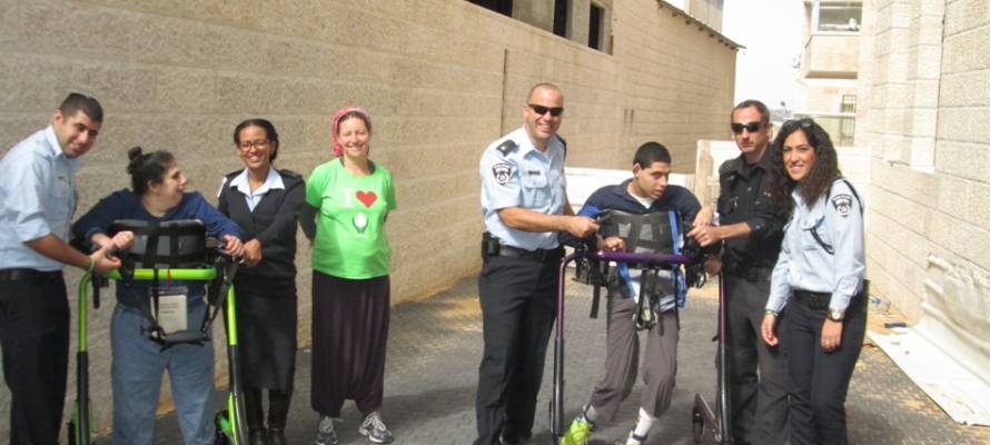 ALEH children with Israel Police officers prepare for the Jerusalem Marathon. (Courtesy)