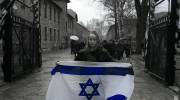 Miriam Ciss Outside Auschwitz Concentration Camp with Flag of Israel