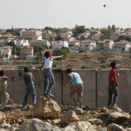 Palestinian youth throw rocks