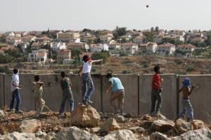 Palestinian youth throw rocks
