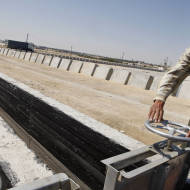 A Palestnian checks water pipes