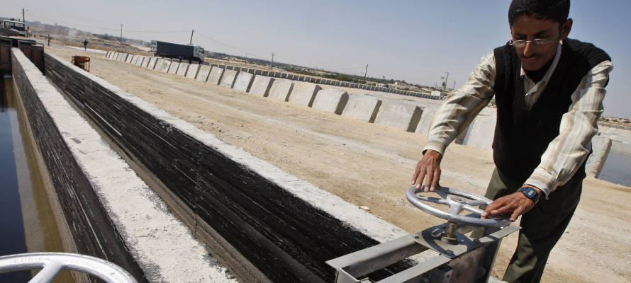 A Palestnian checks water pipes