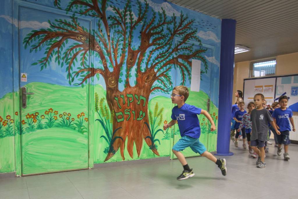 Children participate in an emergency drill.