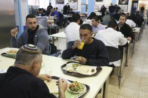 Palestinian and Jewish workers eat together at a SodaStream factory