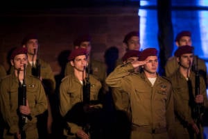 IDF soldiers stand in formation at a ceremony held Wednesday evening at Yad Vashem Holocaust Memorial Museum in Jerusalem, as Israel marks annual Holocaust Remembrance Day. (Hadas Parush/Flash90)