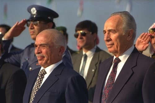  P.M. SHIMON PERES (R) AND KING HUSSEIN OF JORDAN DURING A RECEPTION CEREMONY IN HONOR OF THE KING AT SDE DOV AIRPORT IN TEL AVIV. (GPO)
