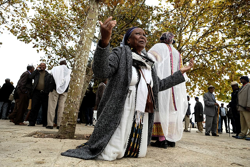 Thousands of Ethiopian Jews take part in a prayer of the Sigd holiday on the Armon Hanatziv Promenade overlooking Jerusalem on November 30, 2016.