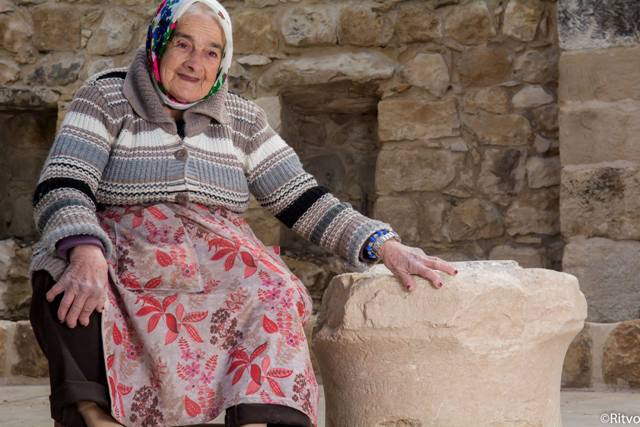 Margalit Zinati of Pekiʽin village, and the ancient stone