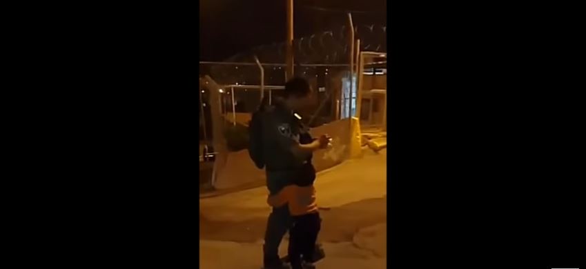 Palestinian child hugs an IDF soldier